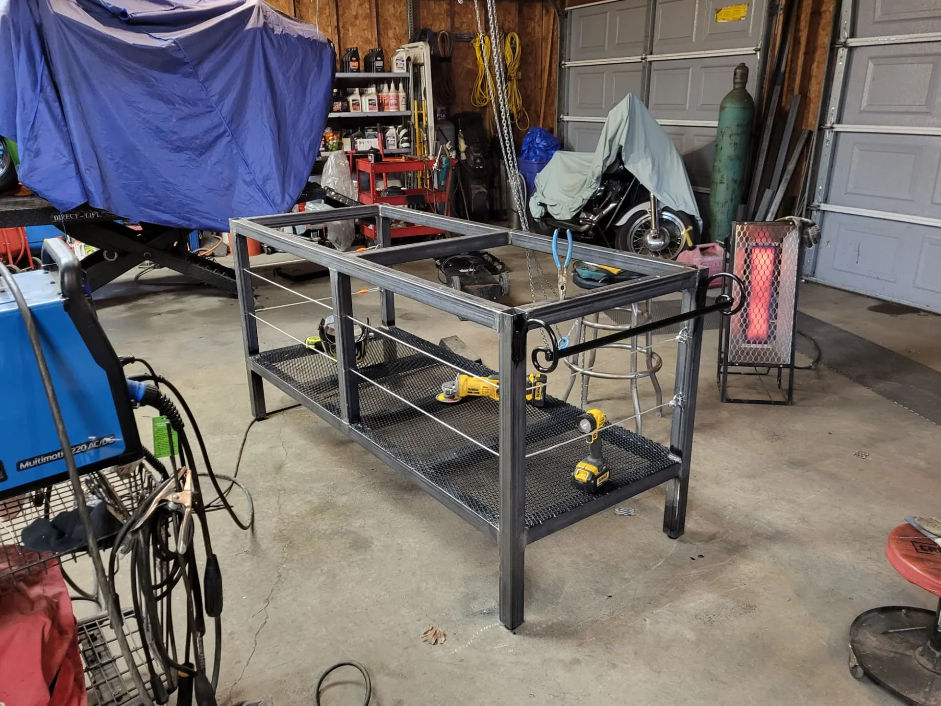 Raw welded steel kitchen island base frame on the CinStar shop floor before finishing