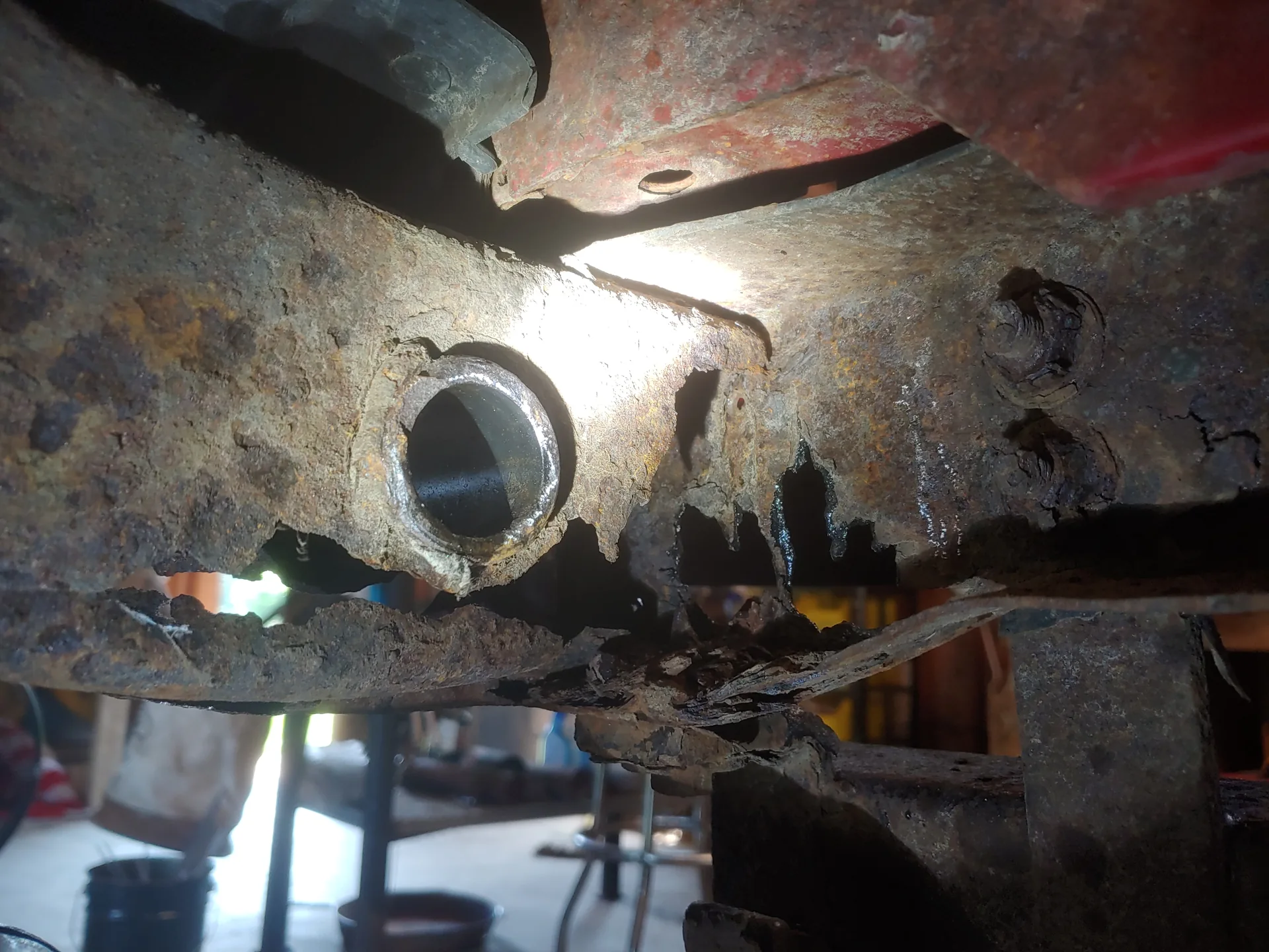 Jeep frame rust-through — before repair at CinStar in Petersburg, Kentucky