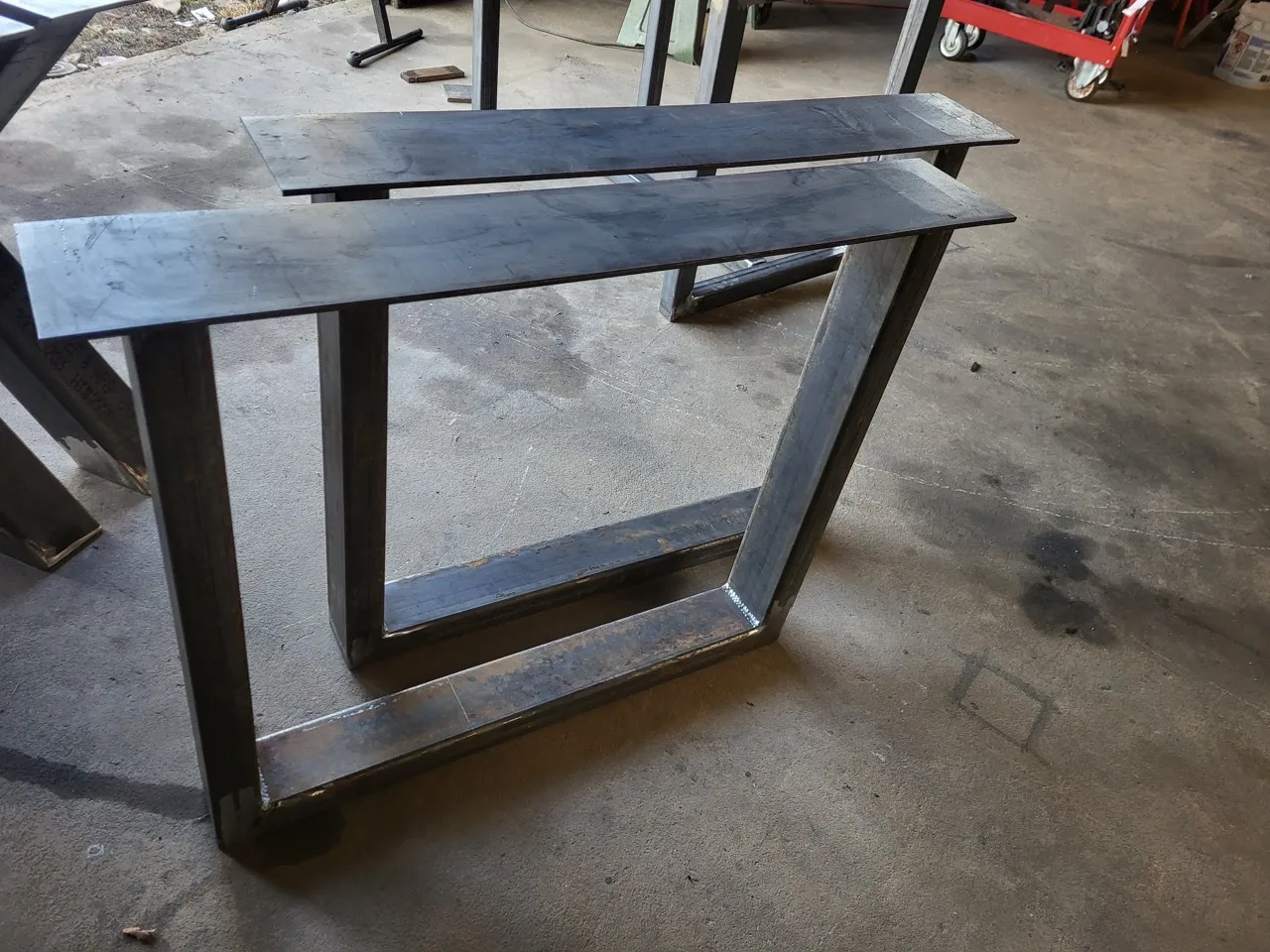 Trapezoid steel table legs fabricated by CinStar for Ohio Wood Connection