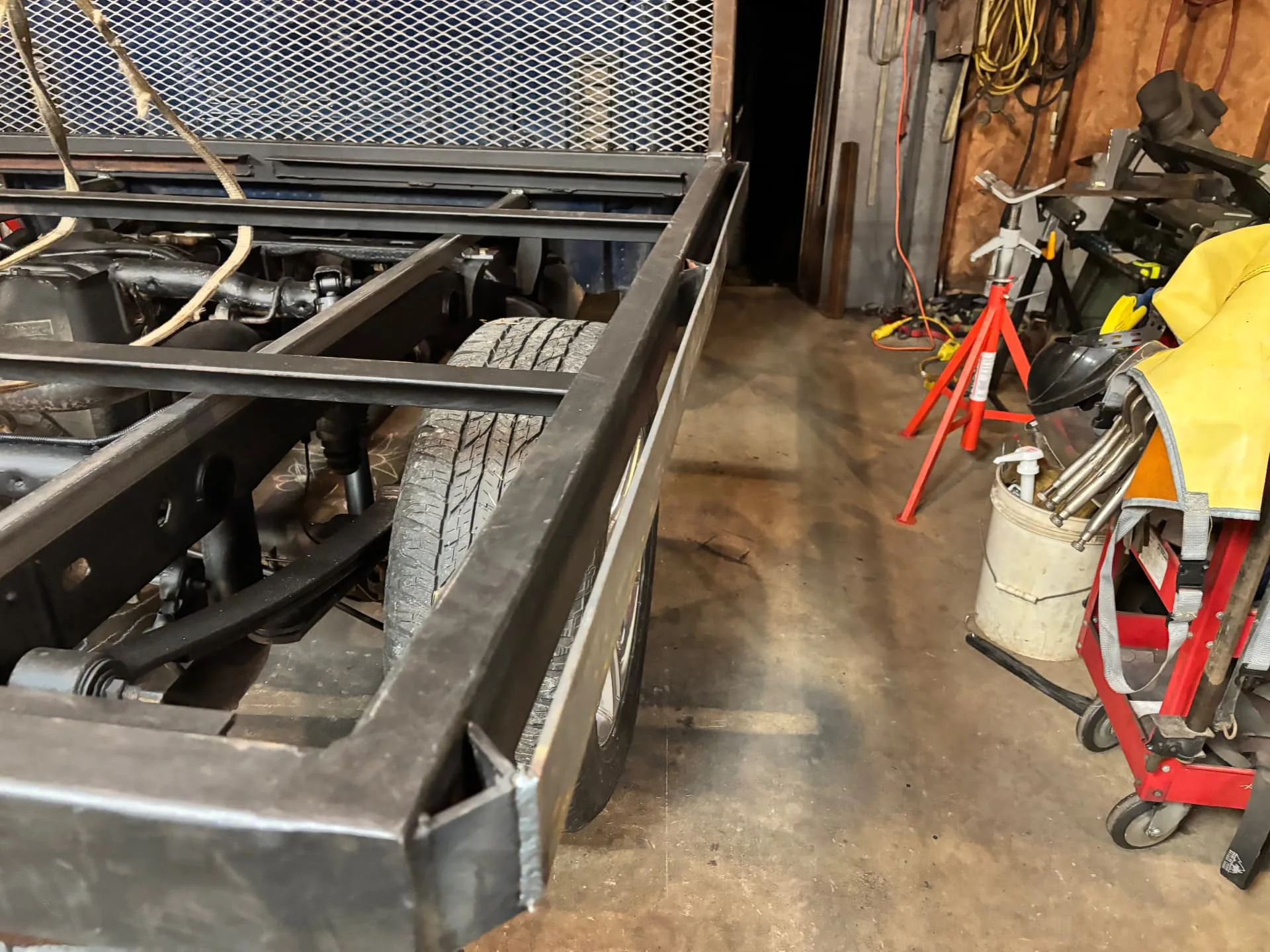 Steel subframe mounted on the truck chassis, side view in the shop, CinStar in Petersburg, Kentucky