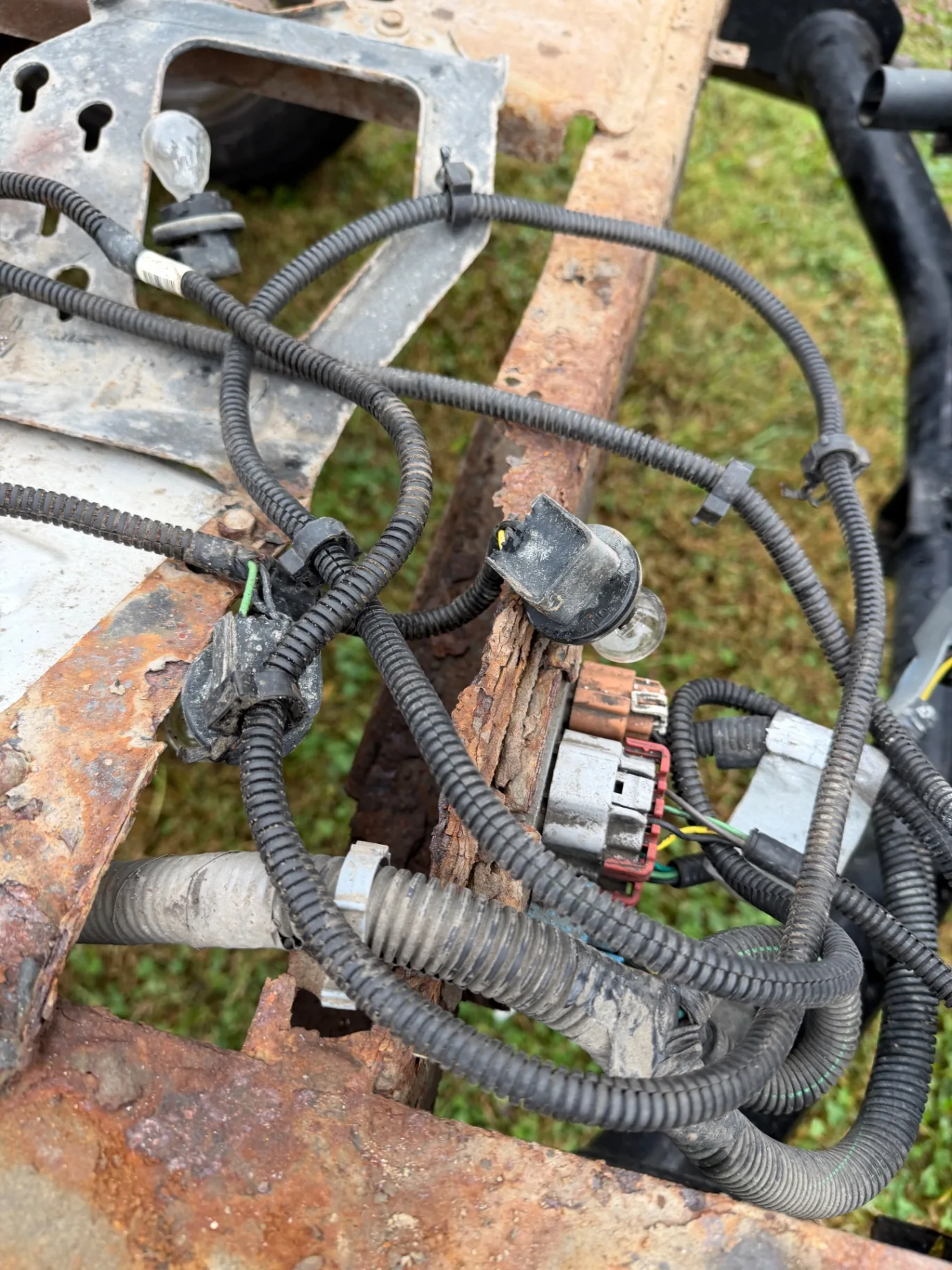 Scaled rear rail and wiring before descaling, CinStar in Petersburg, Kentucky