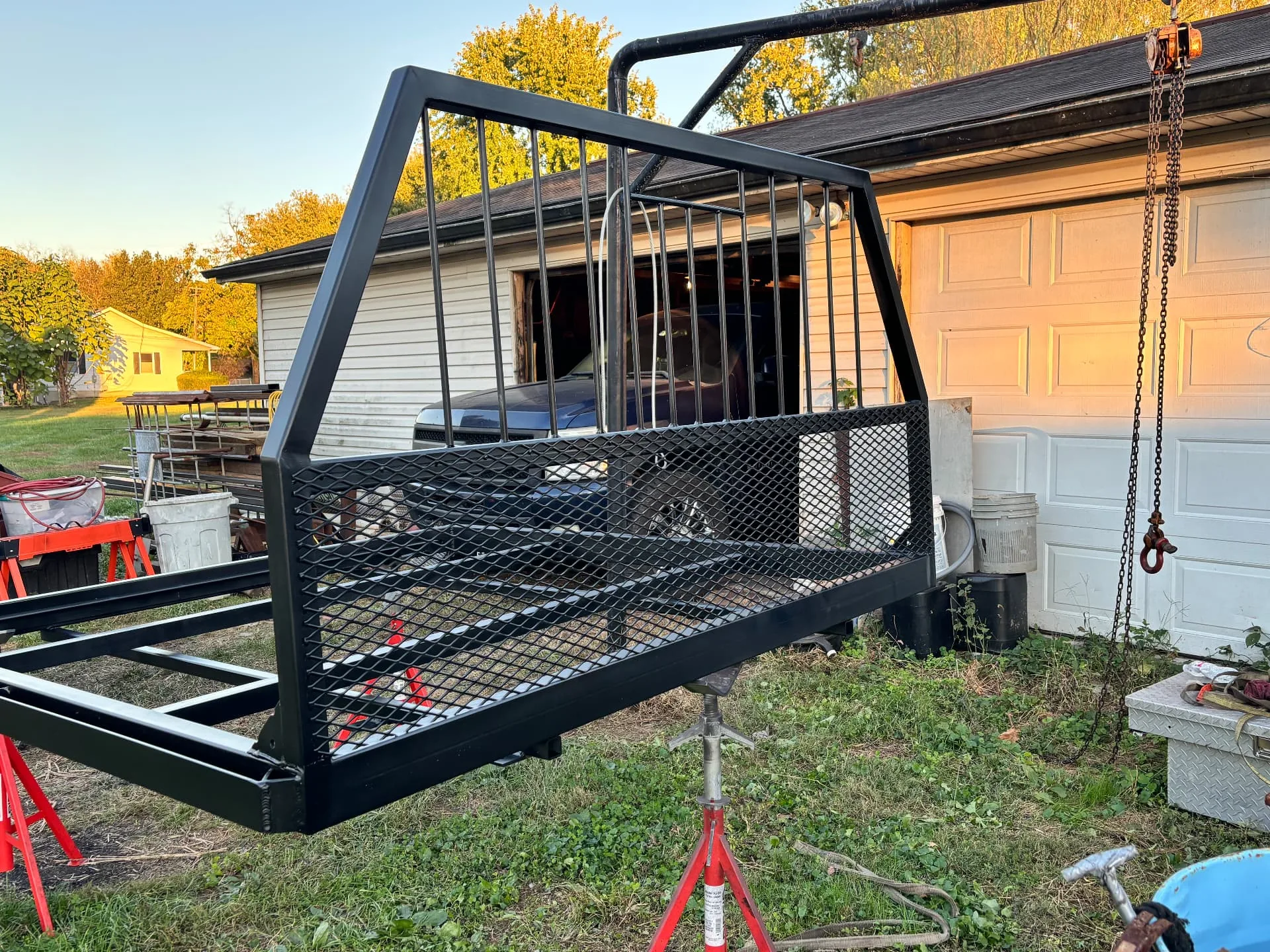 Finished headache rack lifted into place with the chain hoist, CinStar in Petersburg, Kentucky