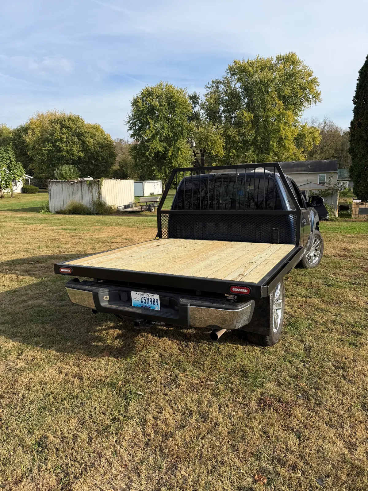 Rear view of an installed steel flatbed with lights and plate mount, CinStar in Petersburg, Kentucky