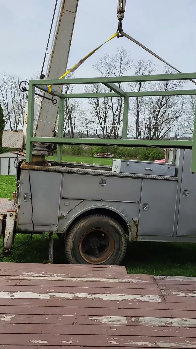 Video preview: CinStar's boom truck crane lifting and setting a heavy steel base at a customer's home