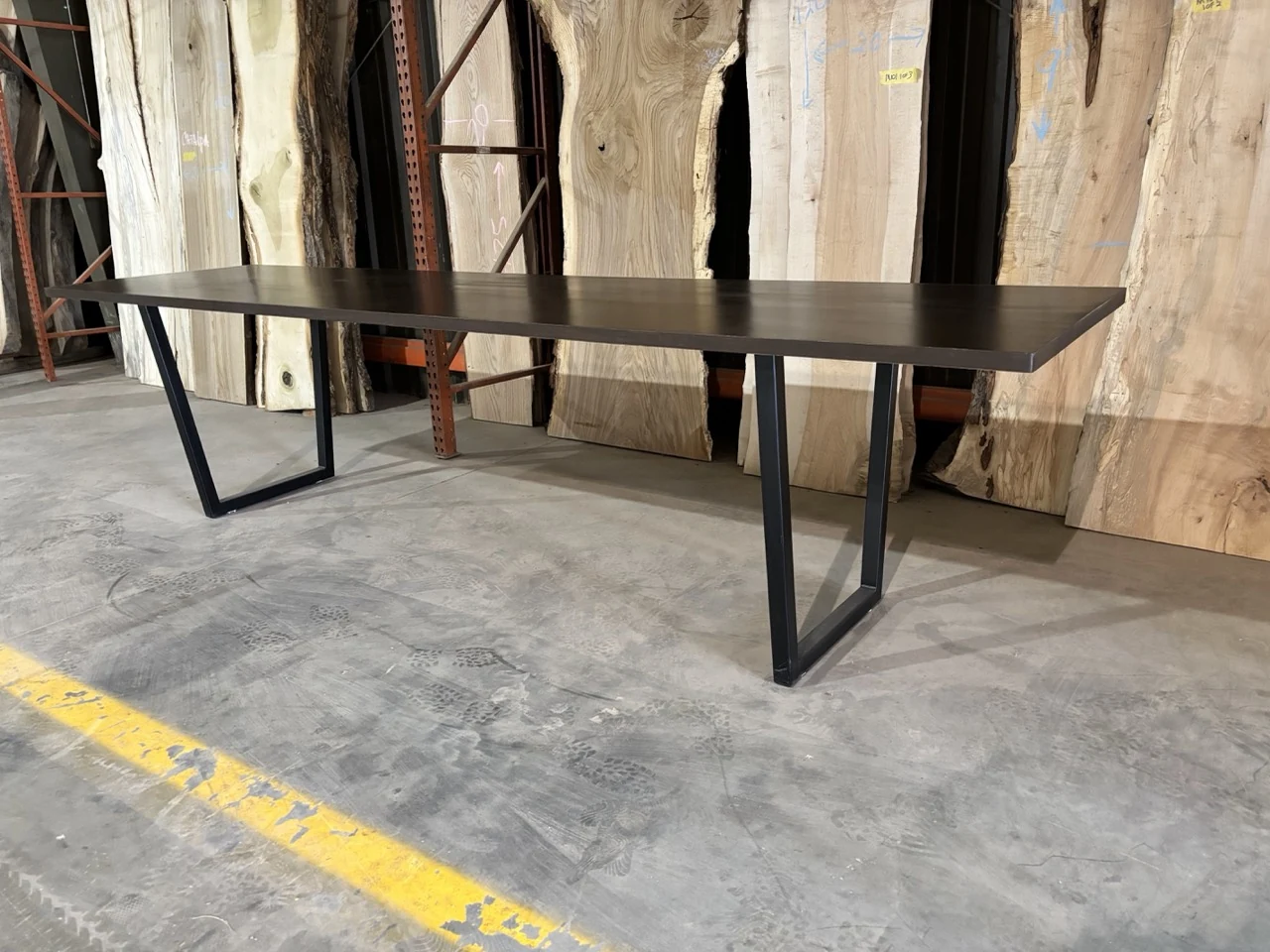 Finished dark wood conference table on CinStar powder-coated steel legs for Ohio Wood Connection