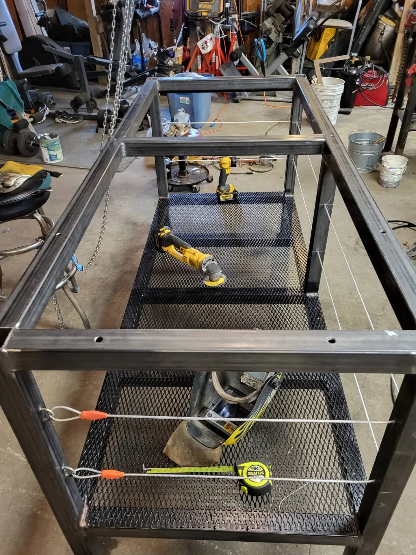 Top view of a welded steel kitchen island base frame in the CinStar shop
