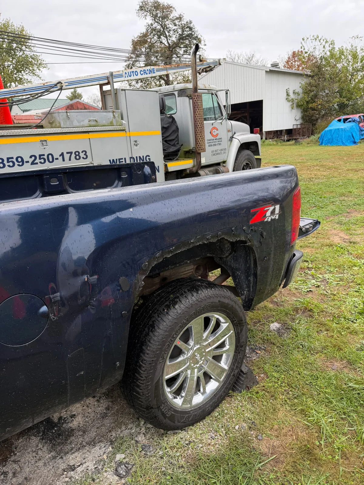 Wheel-arch rust exposed with the fender flare removed, CinStar in Petersburg, Kentucky