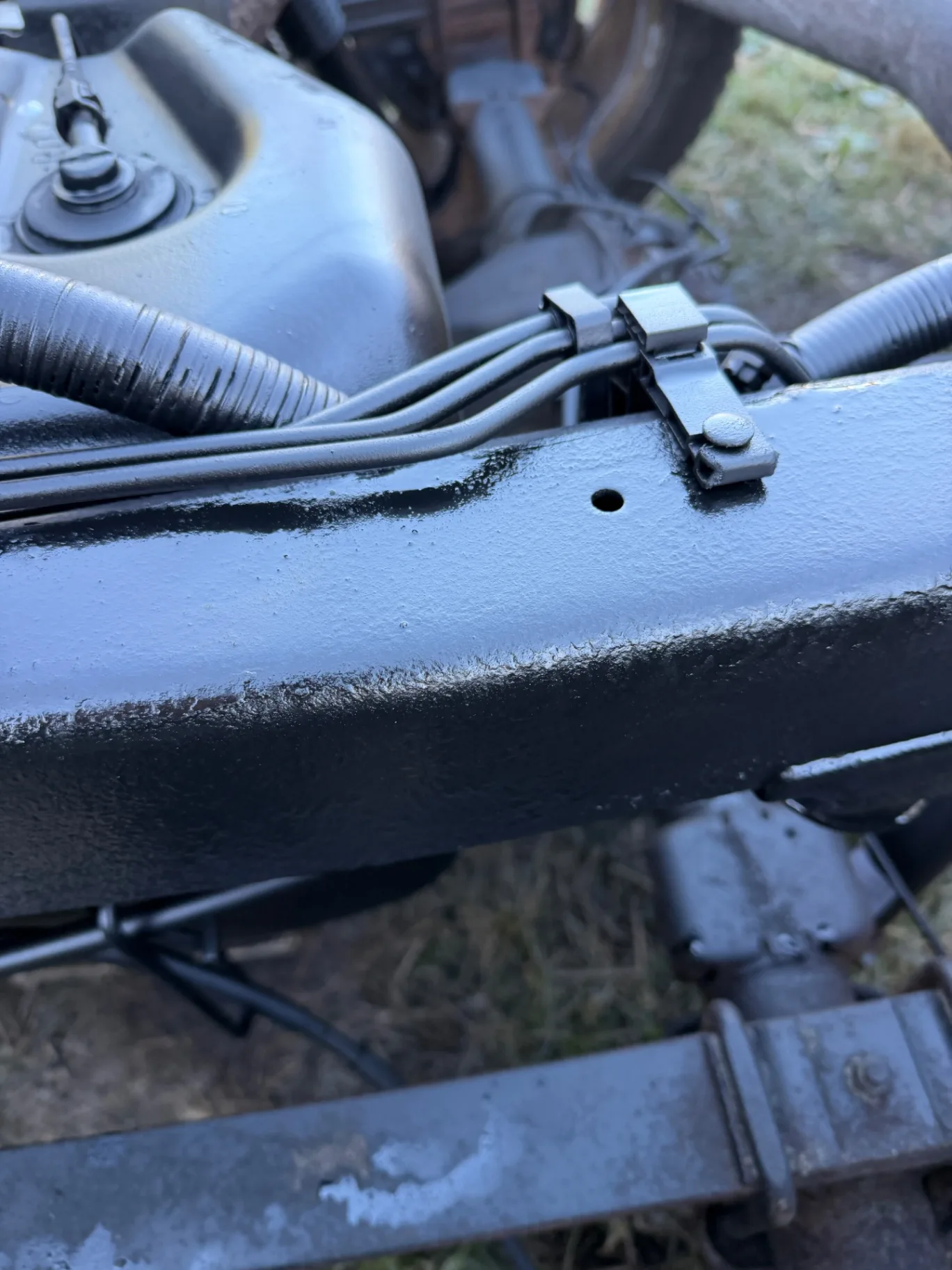 RP-342 Black wax coat on the frame rail, close-up, CinStar in Petersburg, Kentucky